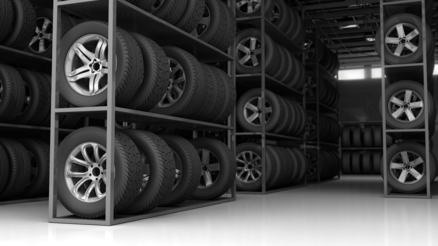 Tires and wheels organized on indoor storage racks